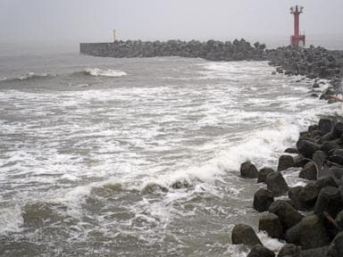 2 tropical storms pound Japan with floods and landslides, killing 1