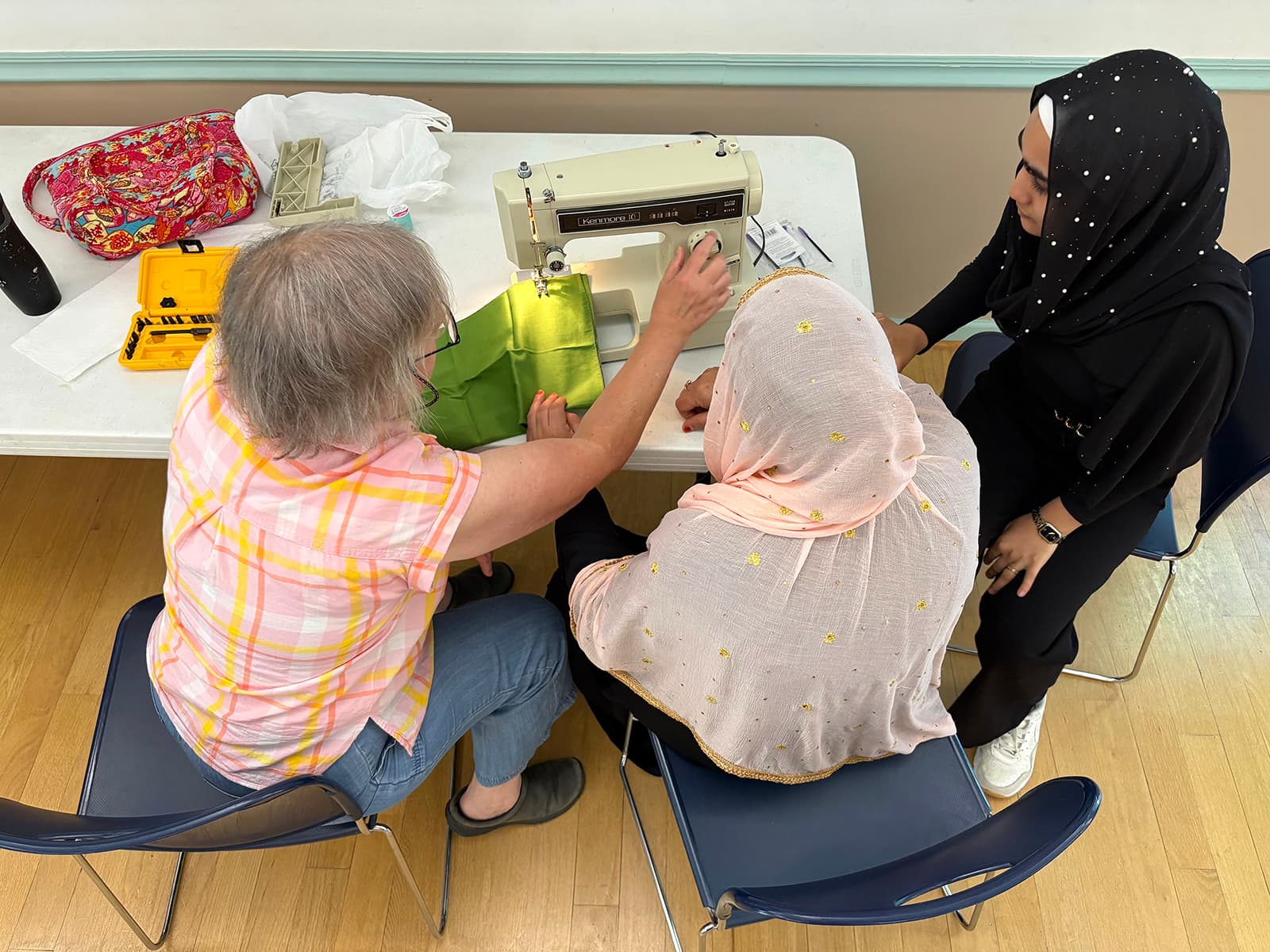 After refugee aid cuts, faith groups help Afghan women connect through sewing