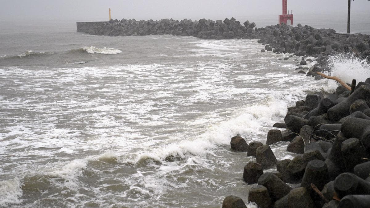 Two tropical storms pound Japan, causing flooding and landslides